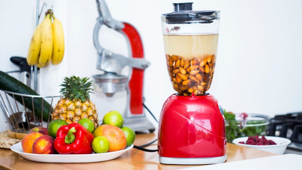 Almonds On Blender With Fruits On The Side