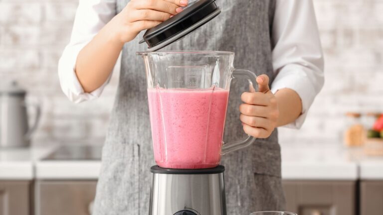 Close-up of Woman Making Pink Smoothie at Home