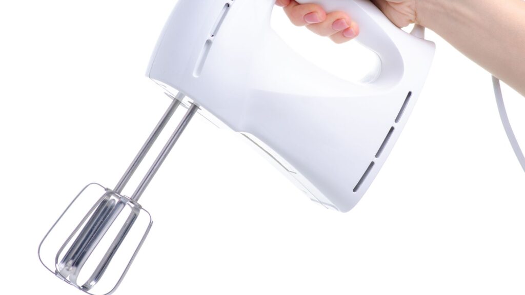 Electric mixer blender in hand