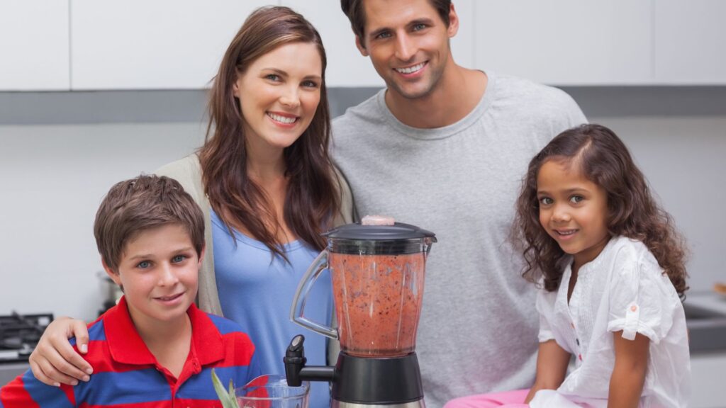 Family posing with a blender