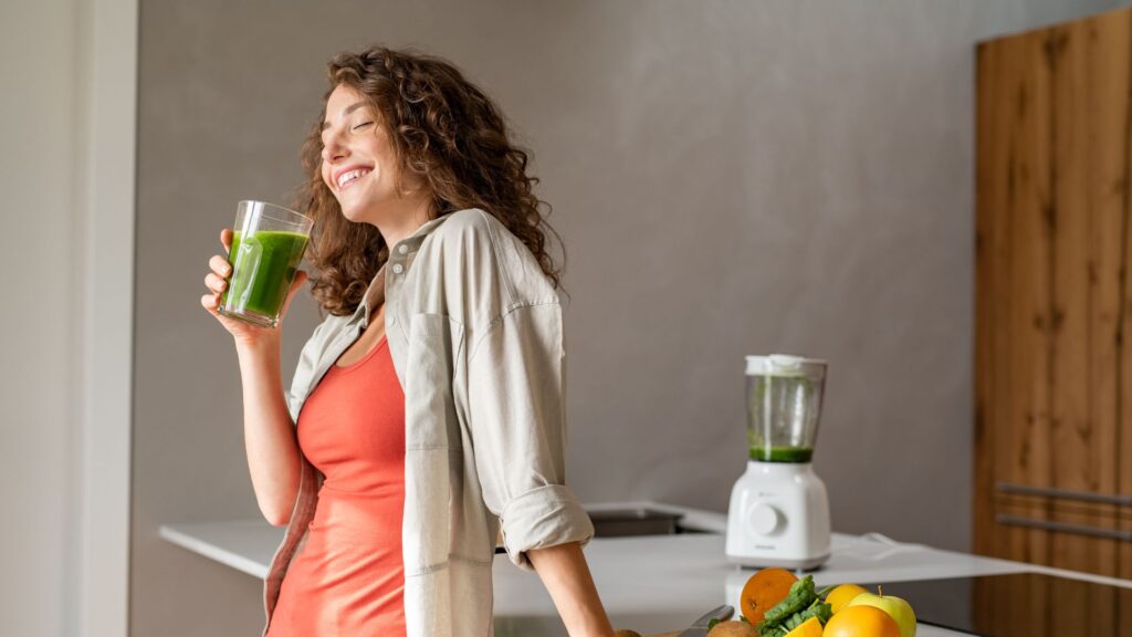 Woman Drinking Detox Drink at Home