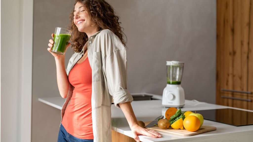 Woman Drinking Detox Drink at Home